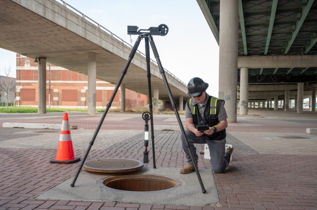 Operator checking live footage on a tablet during a TREKK360 inspection