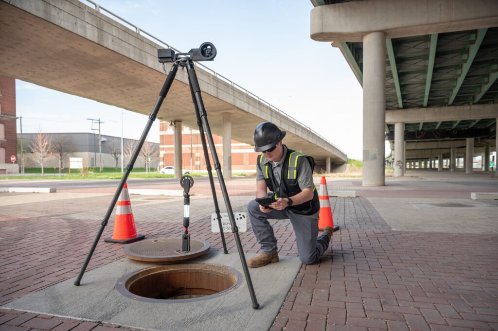 Operator monitoring a TREKK360 manhole inspection on a tablet
